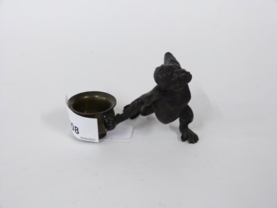 Lot 508 - Bronze model of a monkey holding a bowl