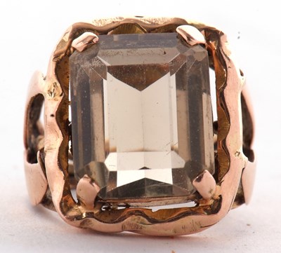 Lot 67 - A citrine dress ring, the emerald cut citrine,...