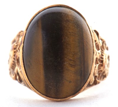 Lot 66 - A 9ct tigers eye ring, the oval tigers eye...