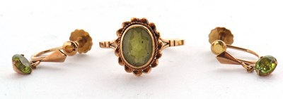 Lot 77 - A 9ct peridot ring and pair of earrings, the...