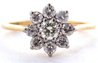 Lot 50 - An 18ct diamond cluster ring, set with round...