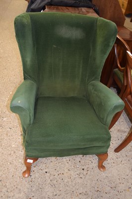 Lot 195 - Early 20th Century green upholstered wing back...