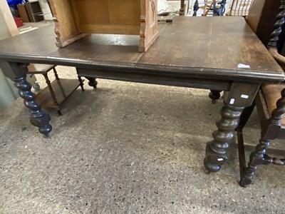 Lot 284 - An early 20th Century oak dining table raised...