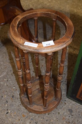 Lot 216 - Small circular stick stand with spindle turned...