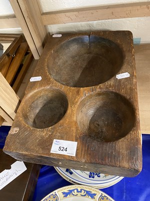 Lot 524 - Three holed wooden morter