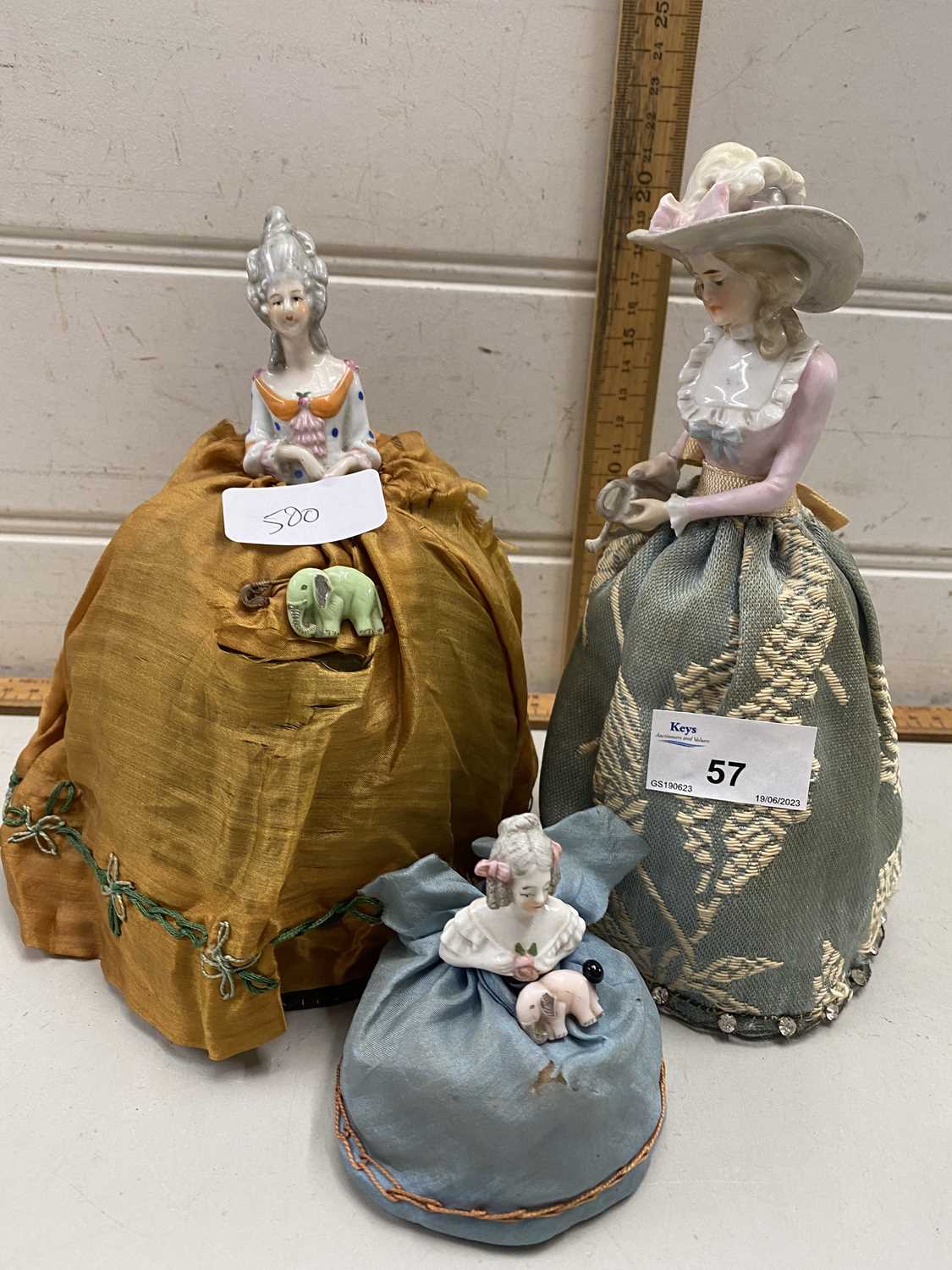 Lot 57 - Three pin cushion dolls