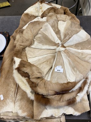 Lot 652 - A circular fur rug together with two circular...