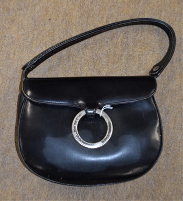 Lot 83 - A black leather bag by Loewe, with saddlebag...