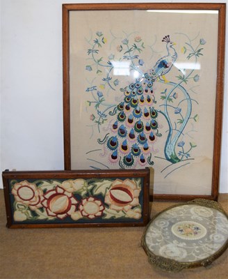 Lot 172 - A needlework picture of a peacock, together...