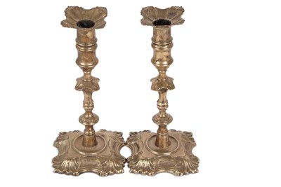 Lot 261 - Pair of George II silver cast candlesticks,...