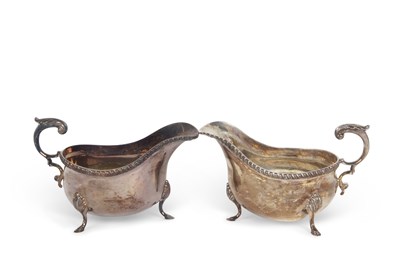 Lot 262 - A pair of silver sauce boats of typical form,...
