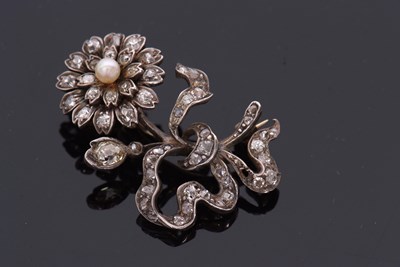 Lot 372 - A Victorian diamond and 'pearl' flower brooch,...