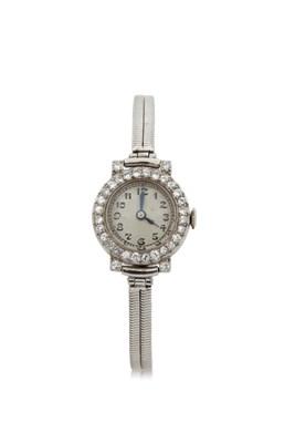 Lot 328A - A precious metal ladies wristwatch on a 9ct...