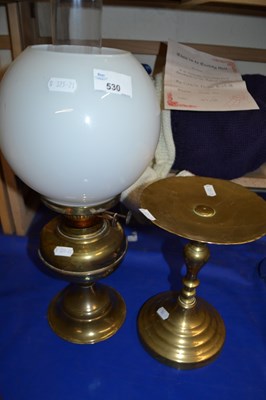 Lot 530 - A brass oil lamp together with a similar stand