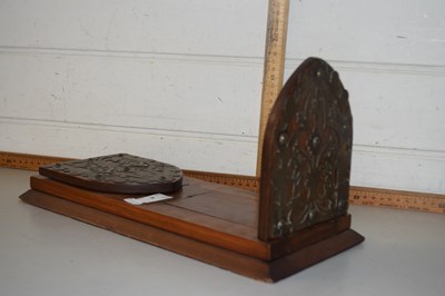 Lot 4 - A mahogany book slide with Gothic style ends...