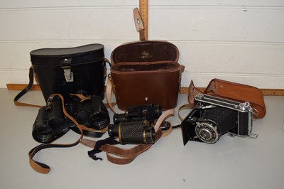 Lot 28 - Two pairs of binoculars and a Welta camera, cased