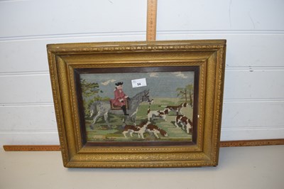 Lot 54 - A needlework picture of a huntsman and dogs in...