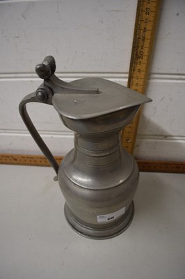 Lot 66 - A continental pewter jug with lid