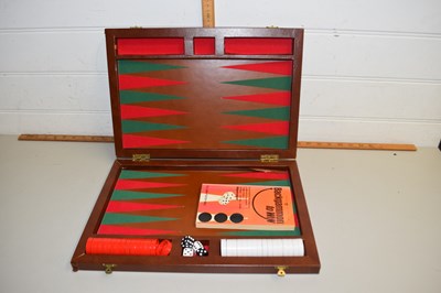 Lot 140 - A back gammon set in wooden box