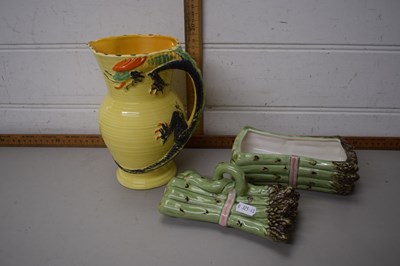 Lot 106 - An asparagus jug and a yellow dragon jug (2)