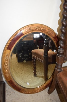 Lot 297 - An oval wall mirror with gilt and wooden  frame