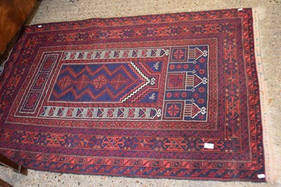 Lot 332 - A red ground rug, approx 153cm long