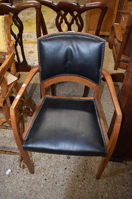 Lot 346 - A faux leather seated elbow chair