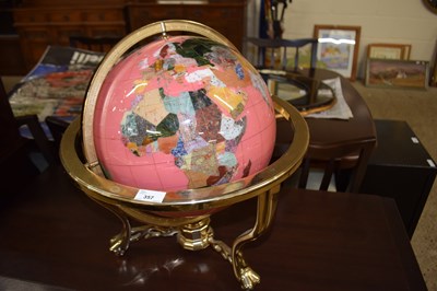 Lot 357 - A hard  stone inlaid pink globe on brass stand