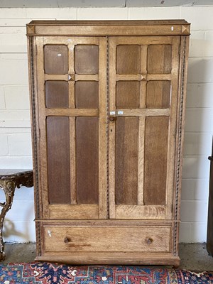 Lot 226 - A oak double fronted wardrobe with two doors...