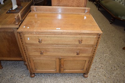 Lot 369 - An oak chest of drawers of two long and...