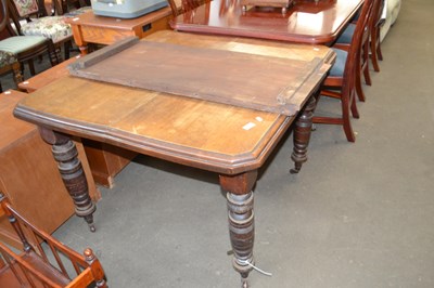 Lot 752 - An oak extending dining table on turned legs...