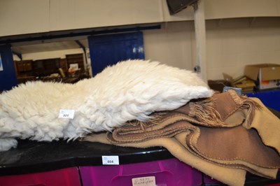 Lot 805 - Sheepskin rug together with a reversible throw