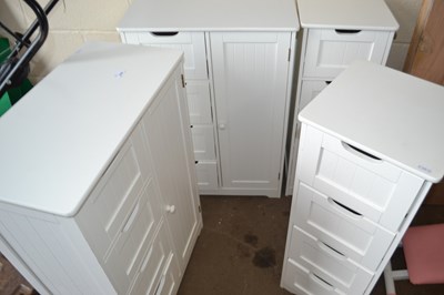 Lot 834 - A pair of white cabinets with single cupboard...