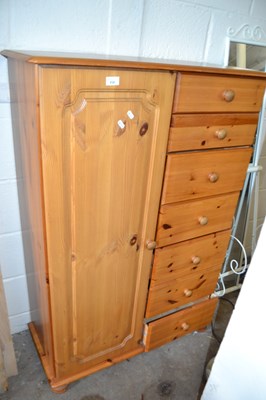 Lot 838 - A pine bedroom cabinet with cupboard and...