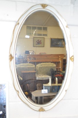 Lot 842 - Cream and gilt decorated oval wall mirror