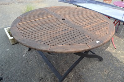 Lot 887 - A folding circular teak garden table, approx...