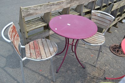 Lot 891 - Purple bistro table with two aluminium and...