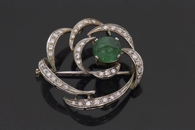 Lot 399 - An 18ct white gold emerald and diamond brooch,...