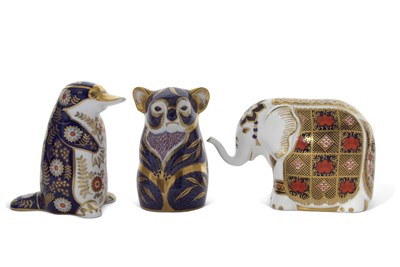 Lot 49 - A group of three Royal Crown Derby paperweith,...