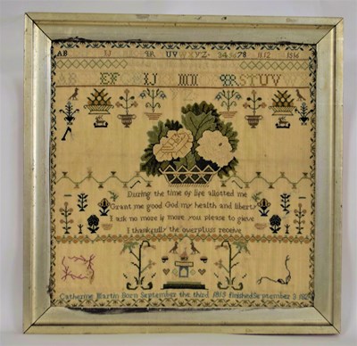 Lot 165 - An early 19th century needlework sampler, with...