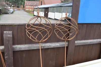 Lot 5 - Pair of metal garden ball-topped ornaments,...