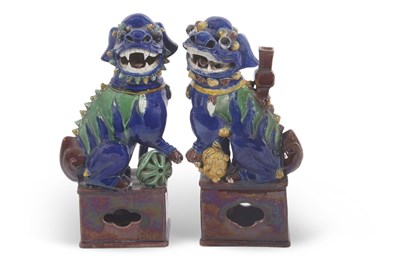 Lot 147 - A pair of Chinese dogs of fo or lions on...