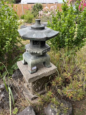 Lot 6 - A decorative garden ornament on a composite...