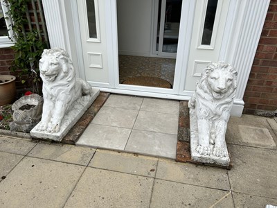 Lot 11 - A pair of composite white painted seated lions,...