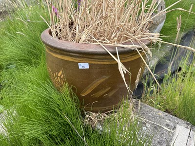 Lot 35 - A pair of terracotta glazed plant pots, height...