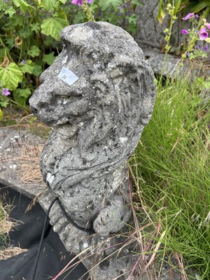 Lot 38 - Composite garden statue formed as a seated...