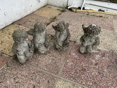 Lot 41 - Four small composite statues formed as cherubs