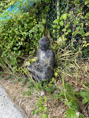 Lot 44 - Two composite garden statues, one of a Buddha...