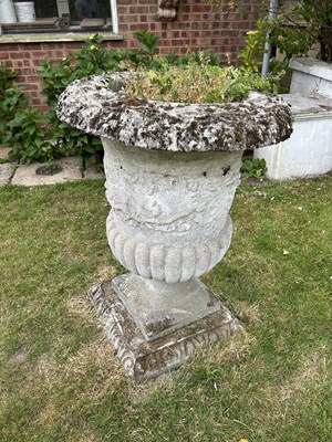 Lot 47 - A pair of composite garden urns with square bases