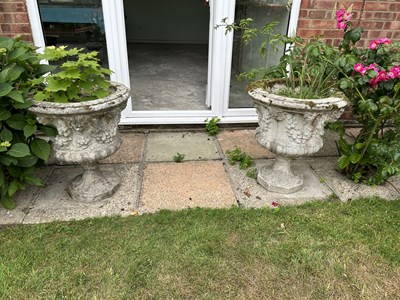 Lot 48 - A set of four matching composite garden urns,...